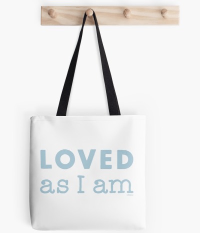 Photograph of a white tote bag with light blue font “LOVED as I am”